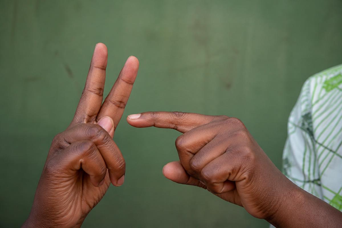 Close-up of Black African hands signing in Nigerian sign language